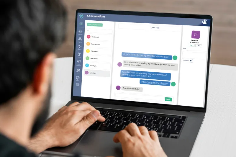 a person on a laptop with the txtsquad app open